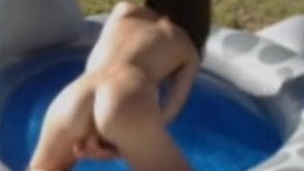 kinky sexy cam girl masturbates in pool like a frog